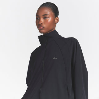 NikeSKIMS STRETCH NYLON OVERSIZED TRACK JACKET | OBSIDIAN