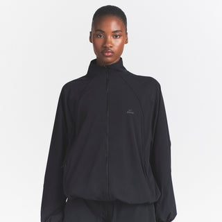 NikeSKIMS STRETCH NYLON OVERSIZED TRACK JACKET | OBSIDIAN