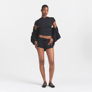 NikeSKIMS STRETCH NYLON RUNNER SHORT | OBSIDIAN