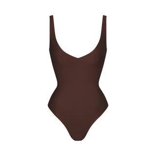 SKIMS BODY UNLINED PLUNGE THONG BODYSUIT | COCOA
