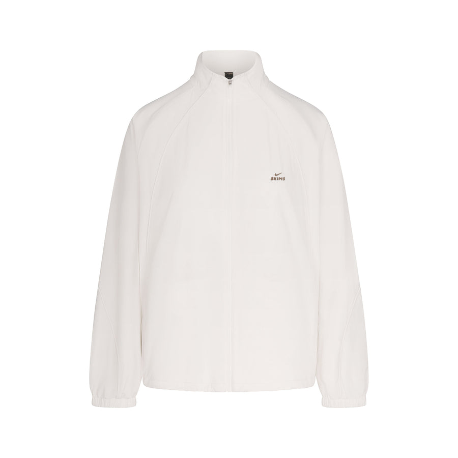 NikeSKIMS STRETCH NYLON OVERSIZED TRACK JACKET | IVORY