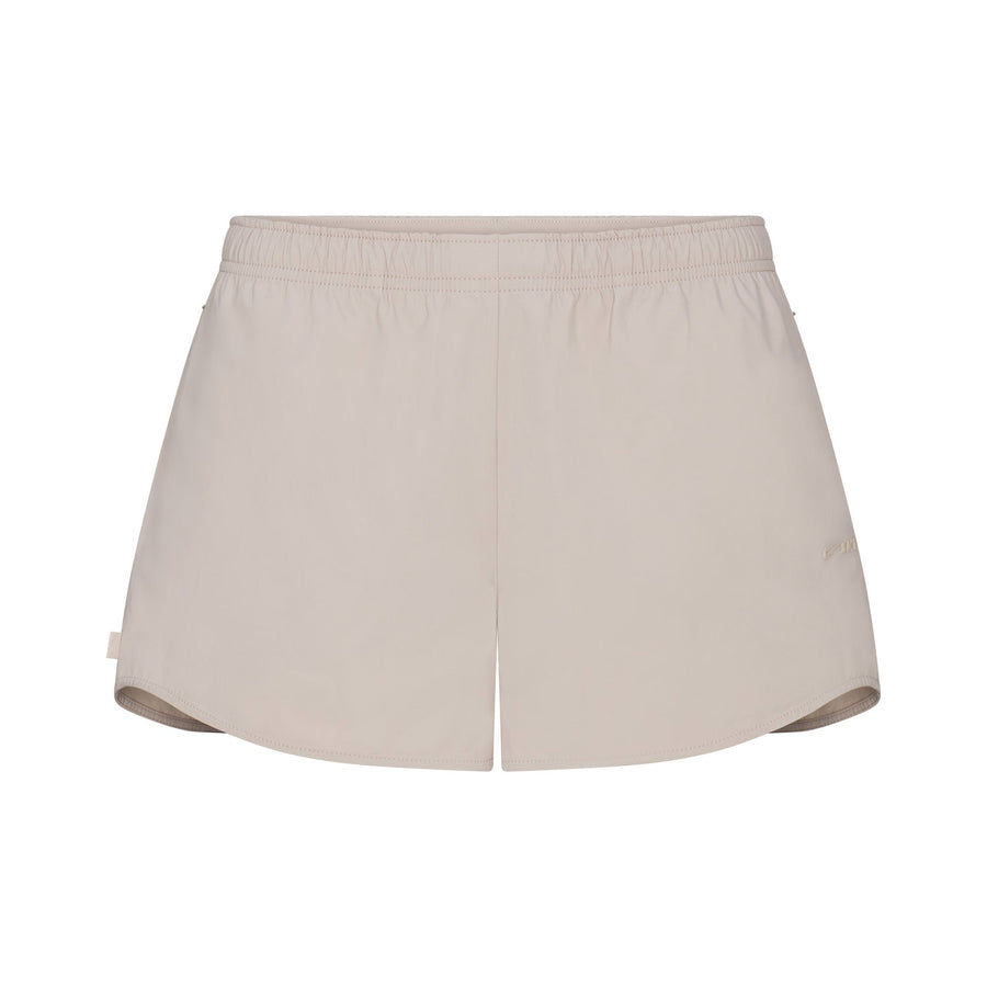 NikeSKIMS WOVEN NYLON 2.5" RUNNER SHORT | STONE