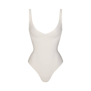 SKIMS BODY UNLINED PLUNGE THONG BODYSUIT | IVORY